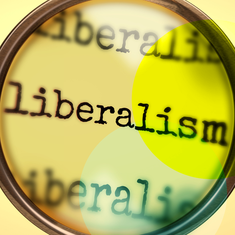 Eine Lupe, die über dem Schriftzug "Liberalism" ist