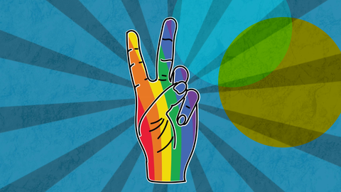 Eine Hand, die in Regenbogenfarben eingefärbt ist und ein Peace-Zeichen zeigt